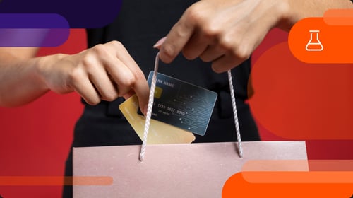 woman-putting-credit-card-shopping-bag