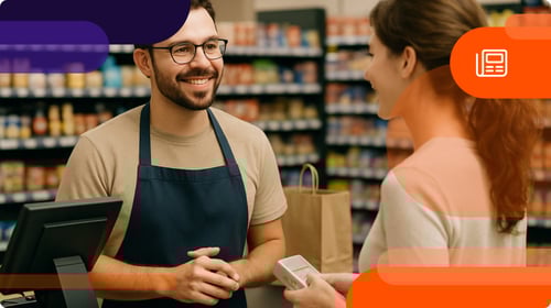 Cashier talking to a customer about a loyalty program