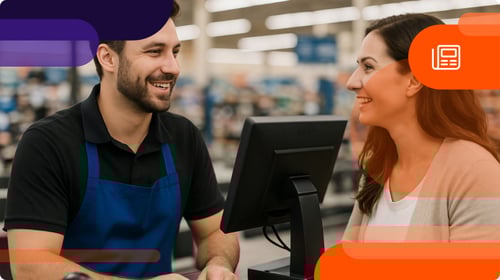 Cashier talking to customer about loyalty program.