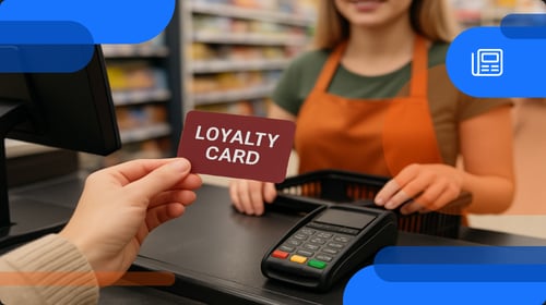 Someone using a loyalty program card at checkout
