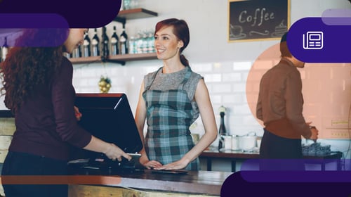 woman behind the counter of a cafe