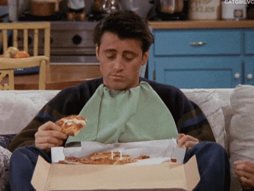 Joey from Friends eating pizza after giving gift cards