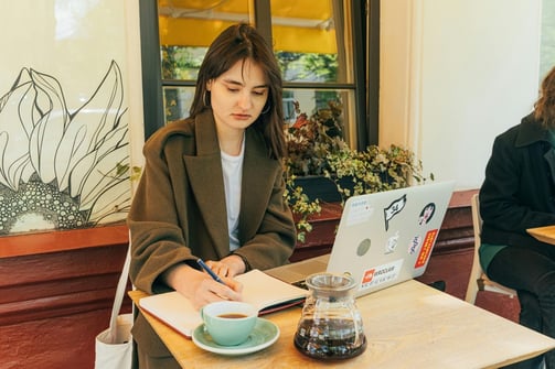 Gen Z Customer at a Cafe with Laptop