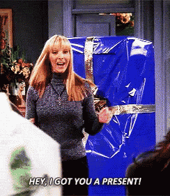 Phoebe from Friends giving a gift card as a present