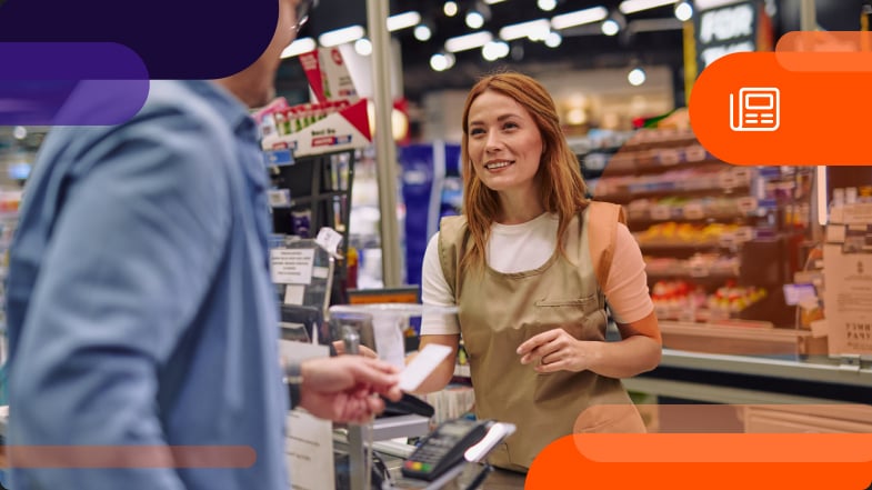 Grocery staff working at the cashier helping a customer